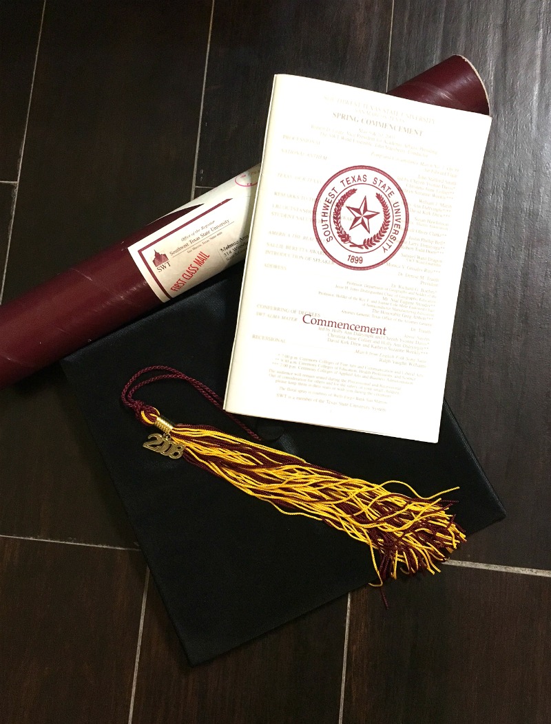 My college gradation diploma, program, hat and tassle