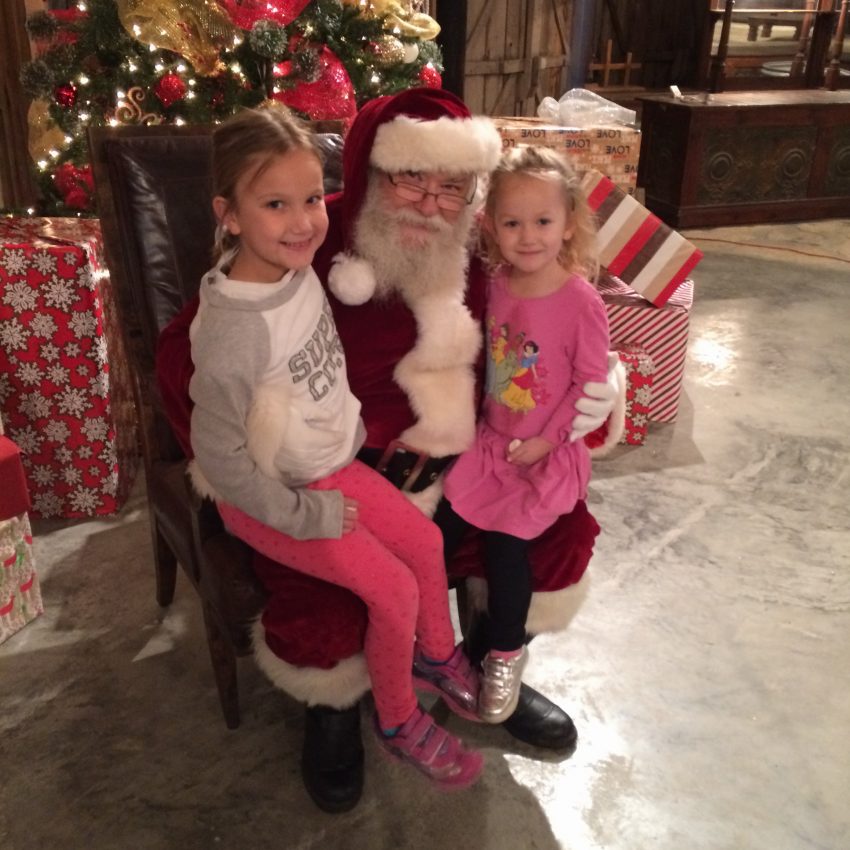 girls-visiting-santa-at-christmas-light-fest