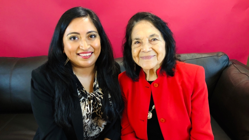 Dolores Huerta sitting with Melanie from Que Means What