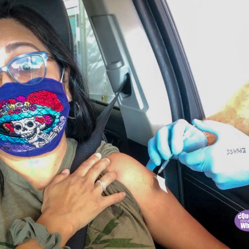 Melanie wearing a mask and receiving a needle shot in her arm - Blog Post: Vaccinated Family Protecting Our Health