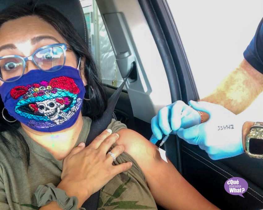 Melanie wearing a mask and receiving a needle shot in her arm - Blog Post: Vaccinated Family Protecting Our Health 